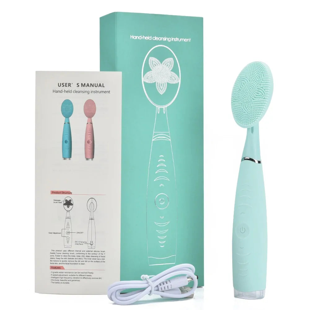 Green rechargeable silicone face cleansing brush with packaging and USB charging cable.